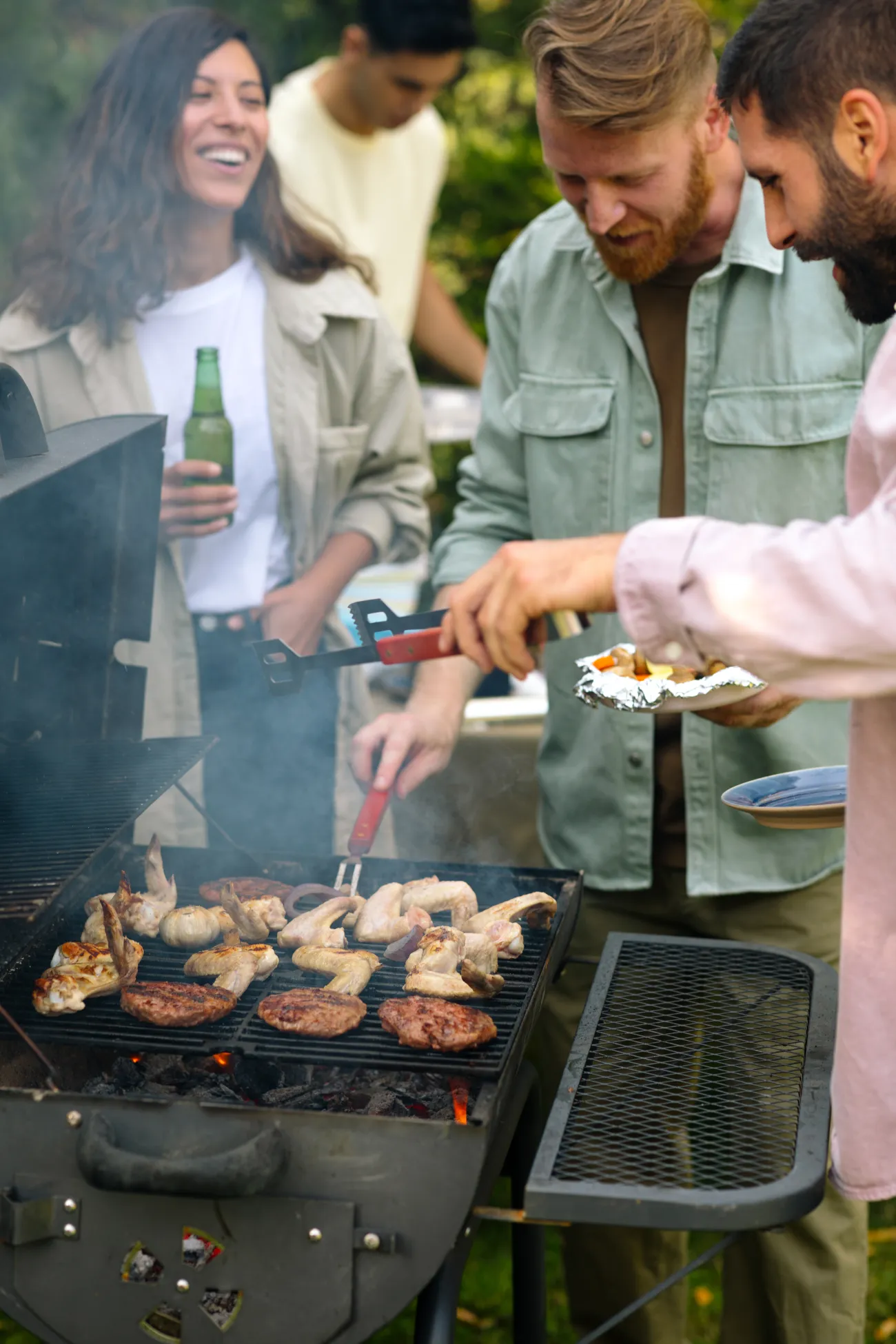 Friends gathered around a barbecue at Salt